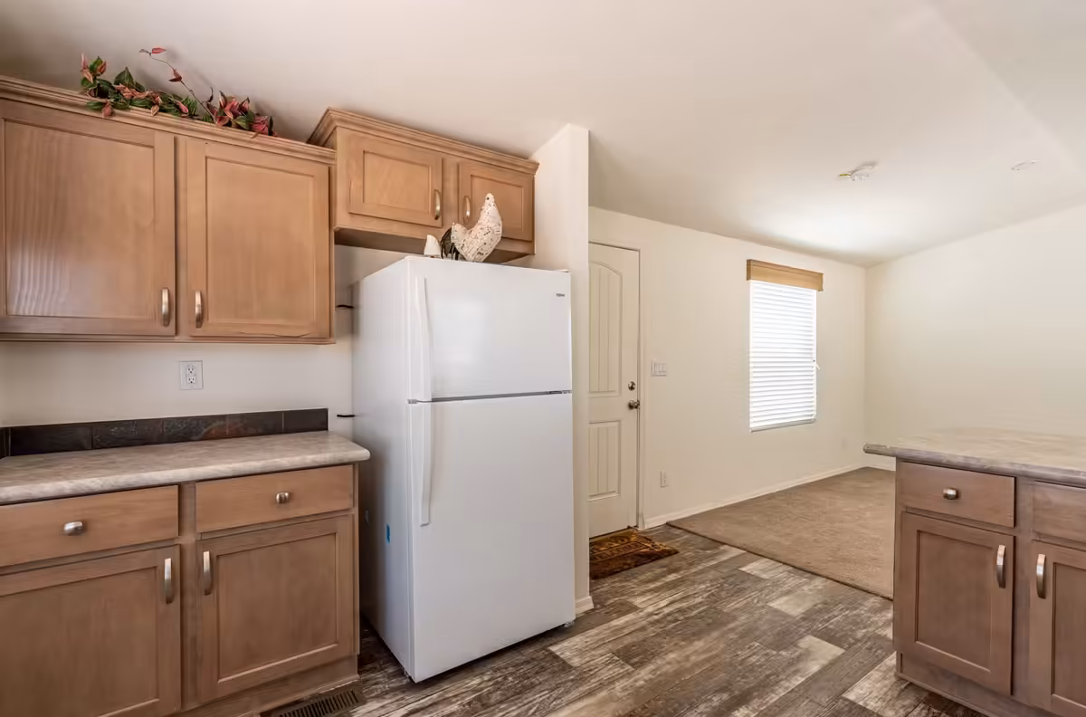 land‑home, on‑site management, sewer‑hookup, factory direct pricing, WindsongfehmesacavcoAkitchen, green‑build